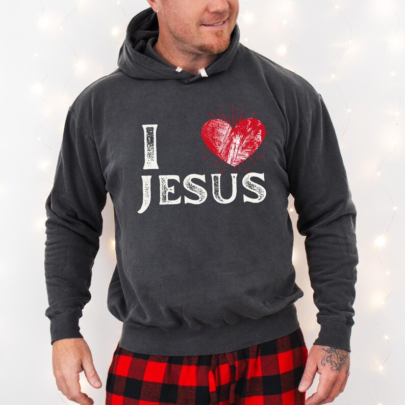 May include: A dark gray hoodie with a distressed white graphic that says "I love Jesus" with a red heart in the middle.