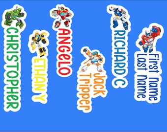 May include: Five colorful name tags with cartoon robot characters. The names are Christopher, Ethan Y, Angelo, Jack Tripper, and Richard C. The last name is written vertically.