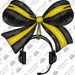 May include: A black and gold bow with a headset hanging from the center. The bow is made of a striped fabric with black and gold stripes.