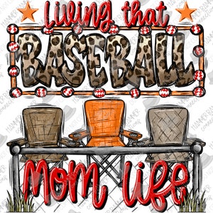 May include: A red and white sign with the text "Living that Baseball Mom Life" in a leopard print font. The sign is hanging above three folding chairs, one orange and two brown, in front of a white fence.