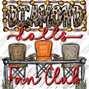 May include: A red and white sign with the text "Diamond Dolls Fan Club" in a leopard print font. The sign is behind three folding chairs, two brown and one orange, in front of a chain link fence.