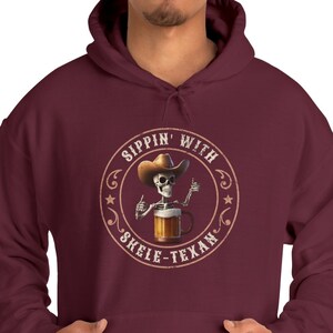Texan Skelton Unisex &#39;Sippin&#39; with Skele-Texan&#39; Hoodie Beer Drinker Gift, Funny Skeleton hoodie Western themed Hoodie