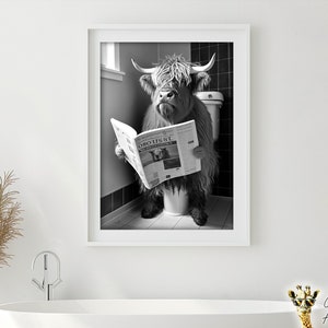 May include: A black and white photograph of a Highland cow sitting on a toilet and reading a newspaper. The newspaper headline reads "ORO USSL".