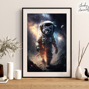 May include: A framed print of a cat wearing an astronaut suit in space. The cat is looking at the camera with a serious expression. The background is a dark blue with stars and planets.