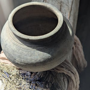 Vintage clay vessel with stand