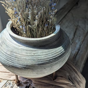 Vintage clay vessel with stand