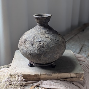 Vintage bottle neck clay vessel with stand