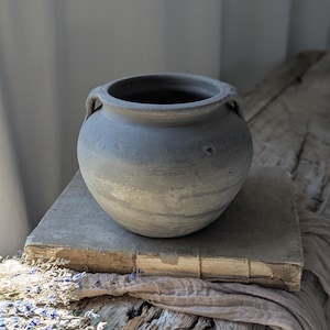 Small vintage clay vessel with handles