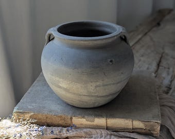 Small vintage clay vessel with handles