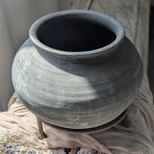 Vintage clay vessel with stand