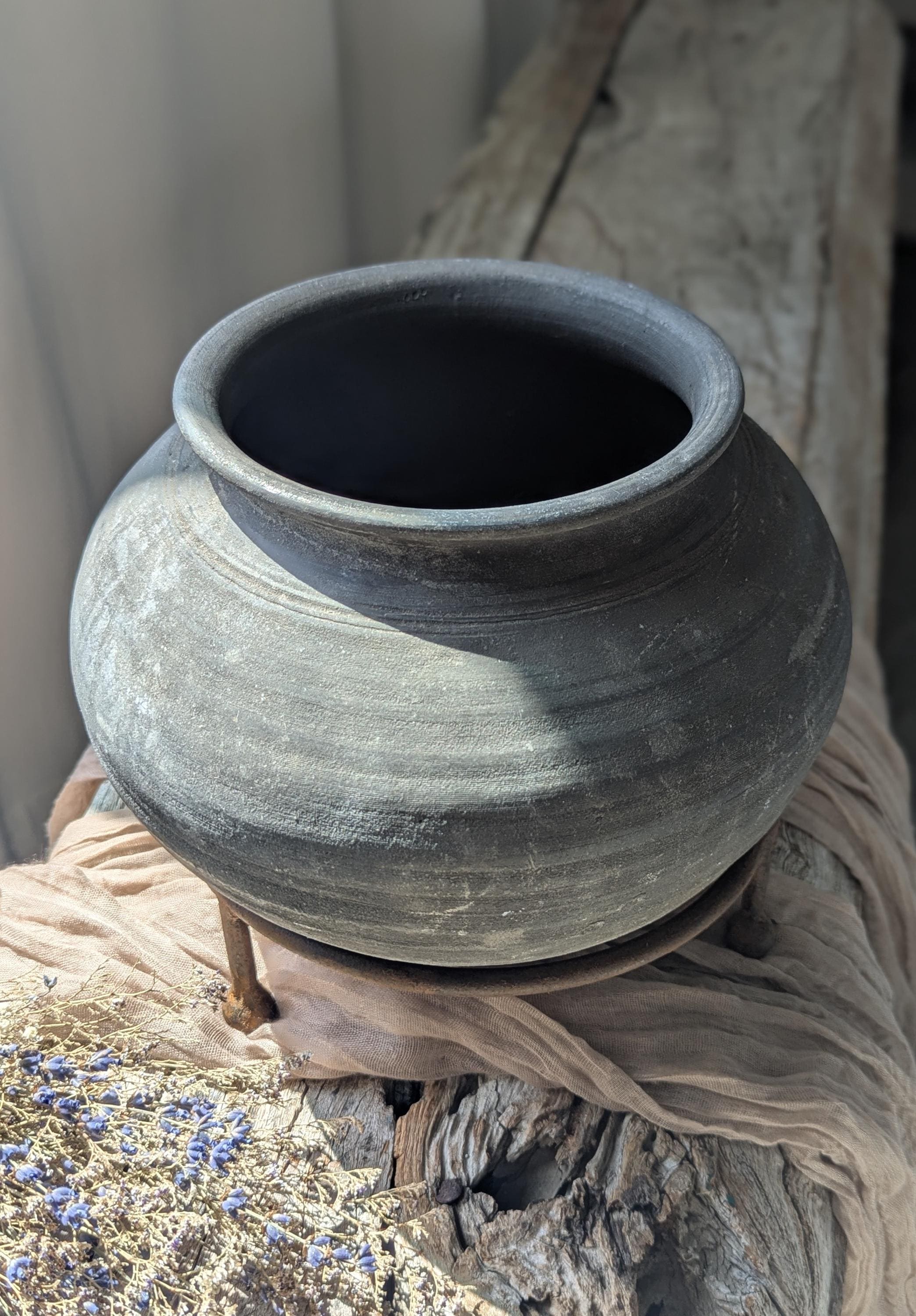 Vintage clay vessel with stand