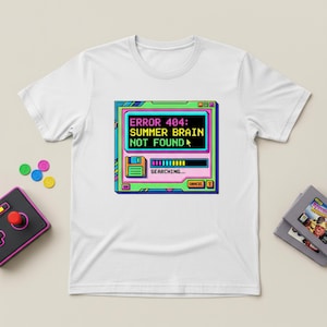 May include: White t-shirt featuring a retro computer screen graphic with the text "ERROR 404: SUMMER BRAIN NOT FOUND". The design includes a loading bar and the word "SEARCHING...". A game controller and game cartridges are also visible.