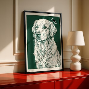 May include: A framed art print featuring a detailed illustration of a Golden Retriever dog. The artwork is in black and white against a dark green background, with the name "Daisy" in white script. The framed print is displayed on a red cabinet.