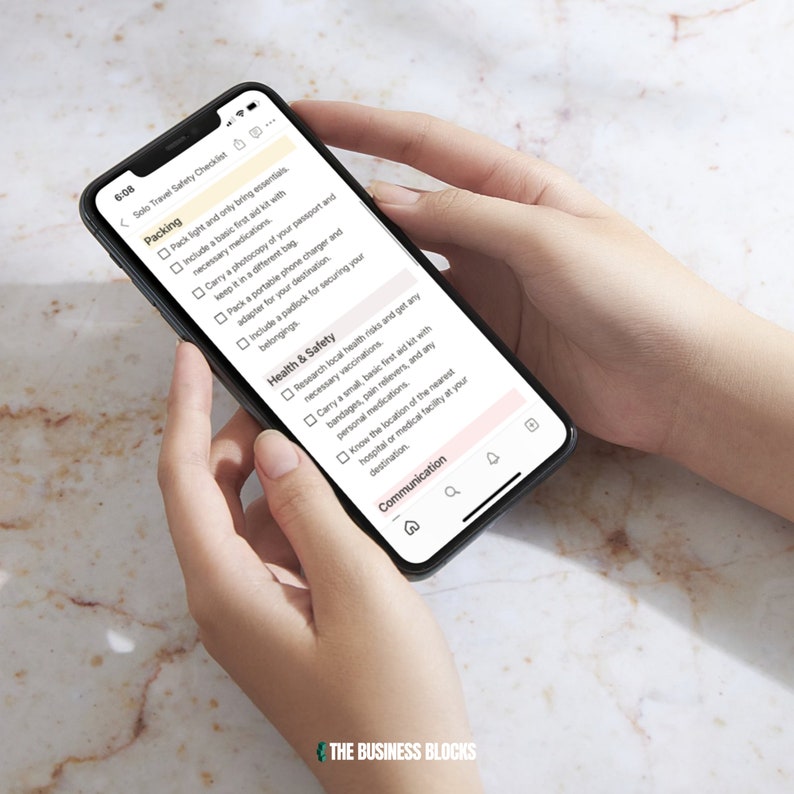 May include: A smartphone screen displaying a solo travel safety checklist with sections for packing, health and safety, and communication. The checklist includes items such as packing light, carrying a first aid kit, researching local health risks, and knowing the location of the nearest hospital.