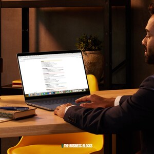 May include: A person working on a laptop computer with a web page open. The page lists various business functions, including "Marketing & Sales", "Operations", "Finance", "Human Resources", "Legal", "Technology", "Customer Service", and "Product Development".