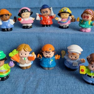 May include: A collection of colorful, small plastic figurines depicting various professions. The figures include a farmer, a teacher, a firefighter, a police officer, and others, each with unique accessories and outfits. The toys are on a blue background.