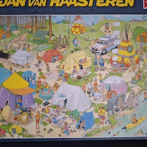 May include: A detailed jigsaw puzzle depicting a camping scene in a forest, with numerous tents, people, and a police vehicle. The puzzle is titled "Jan van Haasteren" and is made by "Jumbo". The scene includes various outdoor activities.