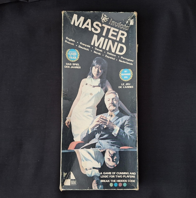 May include: Vintage Invicta Master Mind game box. The box features the game title in large white letters, with images of a man and woman. Text includes "A game of cunning and logic for two players."