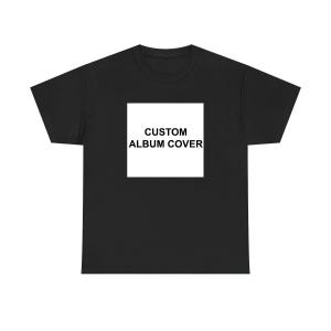 A black t-shirt with a white square containing the text "CUSTOM ALBUM COVER" printed on it.