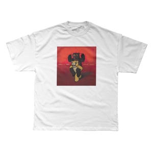 a white t - shirt with a picture of a bear on it