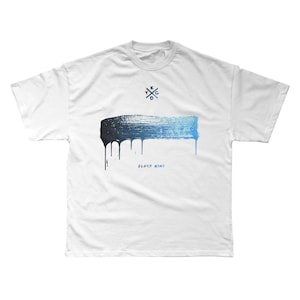 May include: White t-shirt with a blue and black paint splatter design. The paint is dripping down the shirt. The text "CLOUD NINE" is printed below the splatter. A small logo is printed above the splatter.
