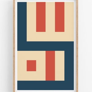 May include: Abstract geometric art print with a beige background, red and dark blue shapes. The print is framed in a light wood frame.