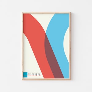 May include: A framed print with a minimalist abstract design featuring overlapping red, blue, and brown shapes. The text "Take the Red Pill" is printed in blue at the bottom of the print.