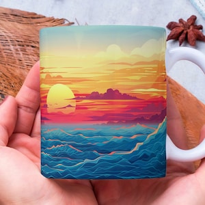 May include: White ceramic mug featuring a vibrant sunset over the ocean design. The mug's artwork showcases a yellow sun, red and purple clouds, and blue waves. The mug is held in both hands.