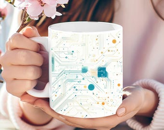 Puede incluir: Taza de cerámica blanca con un diseño de patrones de placa de circuito azul y naranja.