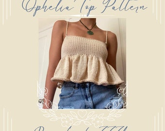 May include: A crochet top pattern called "Ophelia Top Pattern" by "Lucky777Loops". The top is a light beige colour and has a ruffled hem. The model is wearing the top with blue jeans.