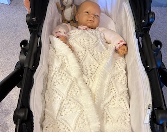 Hand knitted white baby pram blanket