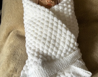Hand knitted white baby pram blanket