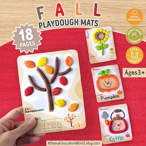 May include: A set of 18 printable fall playdough mats featuring colorful clay designs of a tree, sunflower, pumpkin, and kettle. Each mat includes text labels and interactive shapes for children to recreate with playdough, marked for ages 3+.
