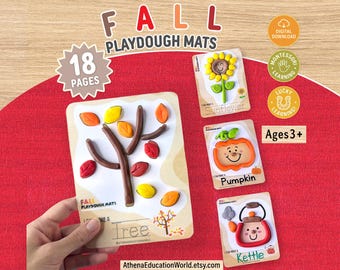 May include: A set of 18 printable fall playdough mats featuring colourful clay designs of a tree, sunflower, pumpkin, and kettle. Each mat includes text labels and interactive shapes for children to recreate with playdough, marked for ages 3+.