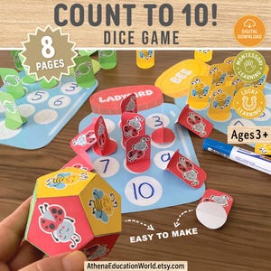 Op de afbeelding: Een kleurrijk dobbelspel met illustraties van lieveheersbeestjes en bijen, ontworpen voor kinderen vanaf 3 jaar. Het spel bevat een dobbelsteen en kaarten met nummers. De tekst "Count to 10!" en "Easy to Make" zijn zichtbaar.