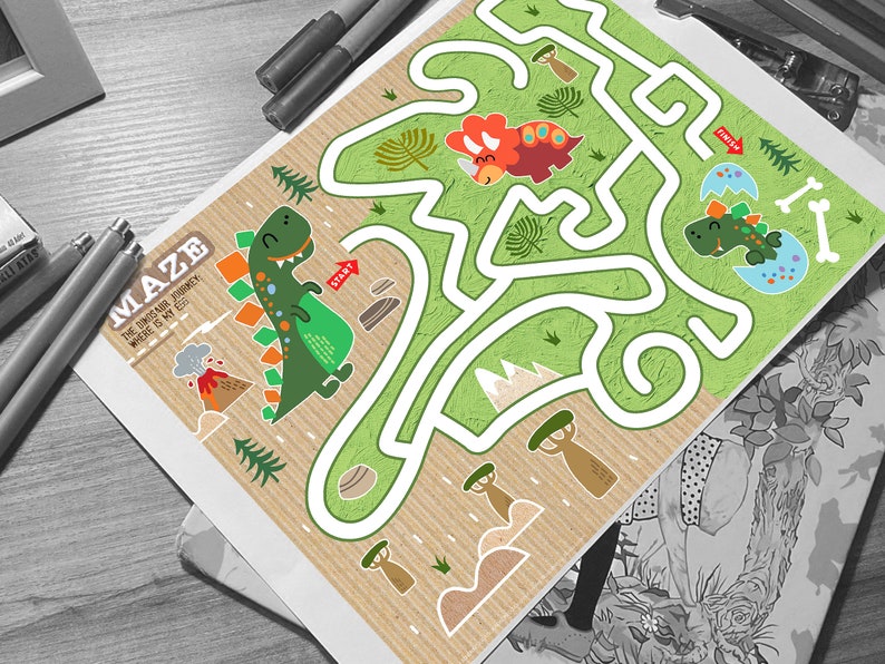 May include: A green dinosaur maze with a brown, textured background. The maze has a start and finish point. The dinosaur is green with orange spikes and is holding a red egg. The maze is surrounded by trees, rocks, and a volcano.