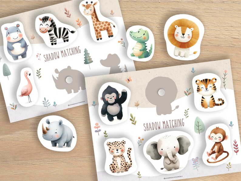 Puede incluir: Un juego educativo para ni&ntilde;os con piezas de rompecabezas con forma de animales y sombras coincidentes. El juego incluye ilustraciones de una cebra, una jirafa, un le&oacute;n, un tigre y otros animales de safari. El texto "SHADOW MATCHING" est&aacute; impreso.