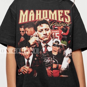 May include: Black t-shirt with a vintage-style graphic print of a football player, featuring the text "MAHOMES Patrick".