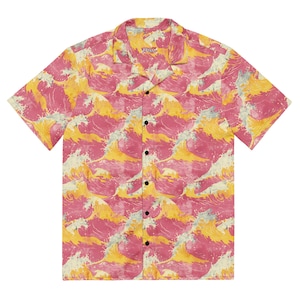 May include: A short-sleeved button-down shirt with a pink and yellow wave pattern. The shirt has a collar and a button closure. The brand name "PPNM" is printed on the collar.