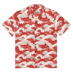 Puede incluir: Camisa de manga corta con botones roja y blanca con un patrón de olas. La camisa tiene un cuello clásico y un cierre de botones.