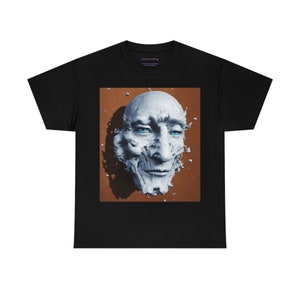 May include: A black t-shirt with a graphic print of a white, abstract face on a brown background.