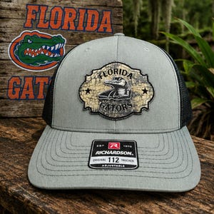 Gators Brushed Nickel Layered patched Hat, Snapback Trucker 112 Style Hat, FL football patch hat, Gators' football, unique Gator hat design.