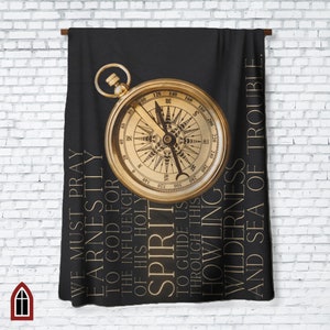 May include: A black and gold compass with the words "We must pray earnestly to God for the influence of His Holy Spirit to guide us through this howling wilderness and sea of trouble." printed around it.