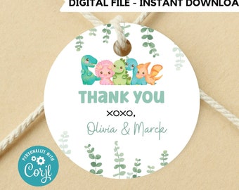 May include: Round thank you tag with a green, white and blue dinosaur theme. The tag features five cartoon dinosaurs with green leaves. The text reads "Thank you xoxo, Olivia & Marck".