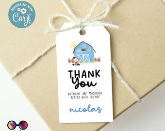 May include: A white thank you tag with a blue barn and a cow illustration. The text reads "Thank You" and "Birthdays are Moooooch Better with Friends" with the name "Nicolas" at the bottom.