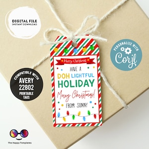 May include: A red and green striped gift tag with a string attached. The tag has a white background with the text "Have a DOH Lightful Holiday Merry Christmas! From: Sonny" and a string of Christmas lights. The tag is compatible with Avery 22802 printable tags.