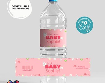 Könnte beinhalten: Rosa-weißes Wasserflaschenetikett mit dem Text "Willkommen Baby Sophie!" und einem tropischen Thema. Das Etikett hat einen Barcode und das Datum "10. Juli 2023".