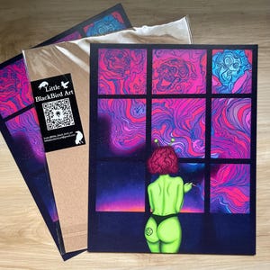 May include: A digital art print featuring a green alien woman with pink hair standing in front of a window. The window is divided into nine panes, each showing a different abstract design in shades of pink, purple, and blue. The woman is holding a cigarette in her hand and looking out the window. The print is titled "Little Black Bird Art" and includes a QR code.