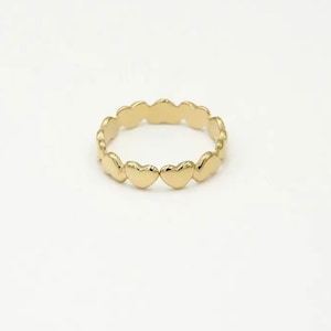 Gold ring with hearts pattern