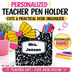 May include: A personalized teacher pen holder with the name "Mrs. Jensen" on a white label. The black and white composition notebook-style holder has a yellow pencil and pink heart accent. Dimensions are 5.2" x 4.9" x 1.9".